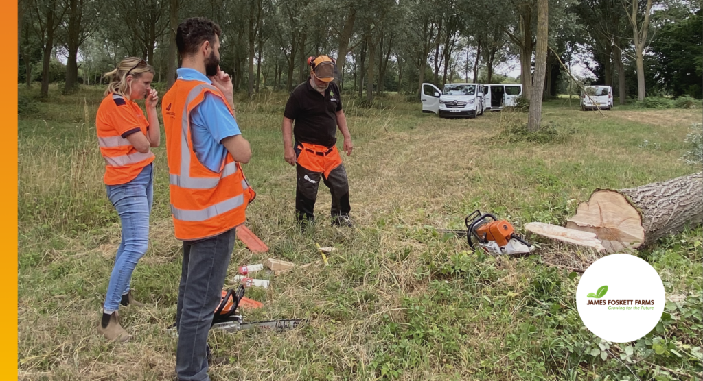James Foskett Farms and Foskett Willows site visit, with the team inspecting a felled willow tree and forestry equipment in the field.
